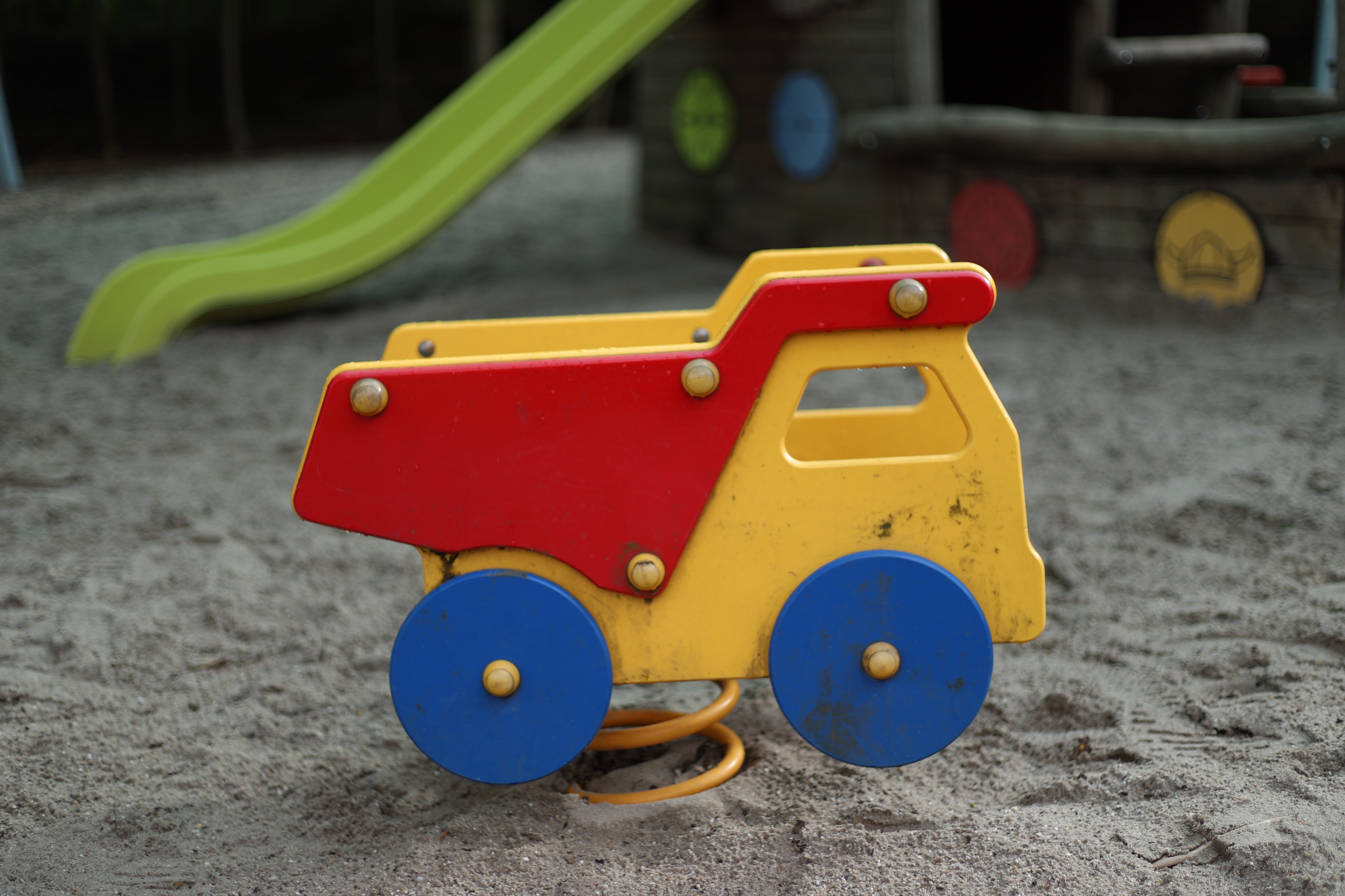 Photo of a toy truck in a sandbox